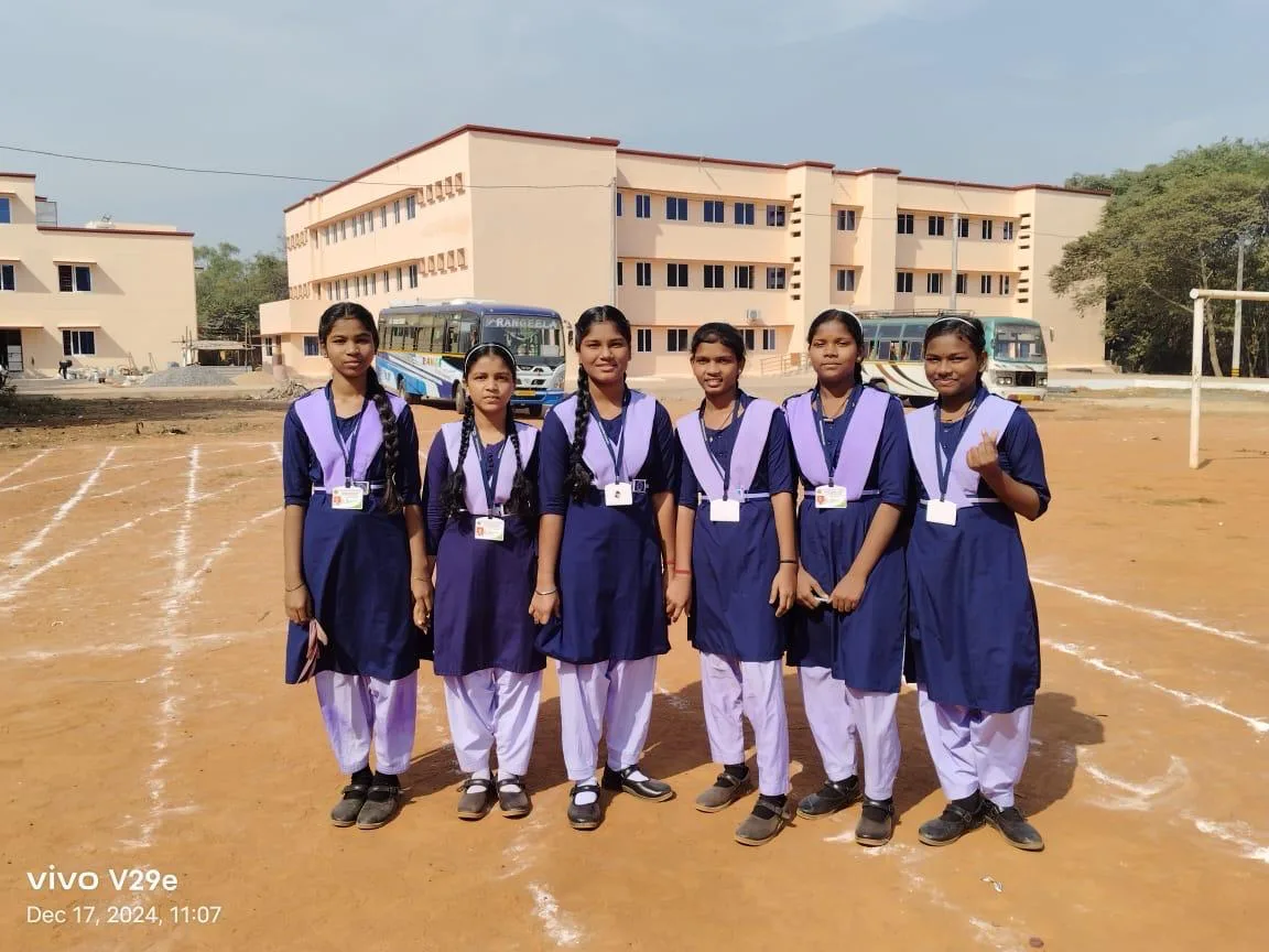 Girl students lined up together on a school campus