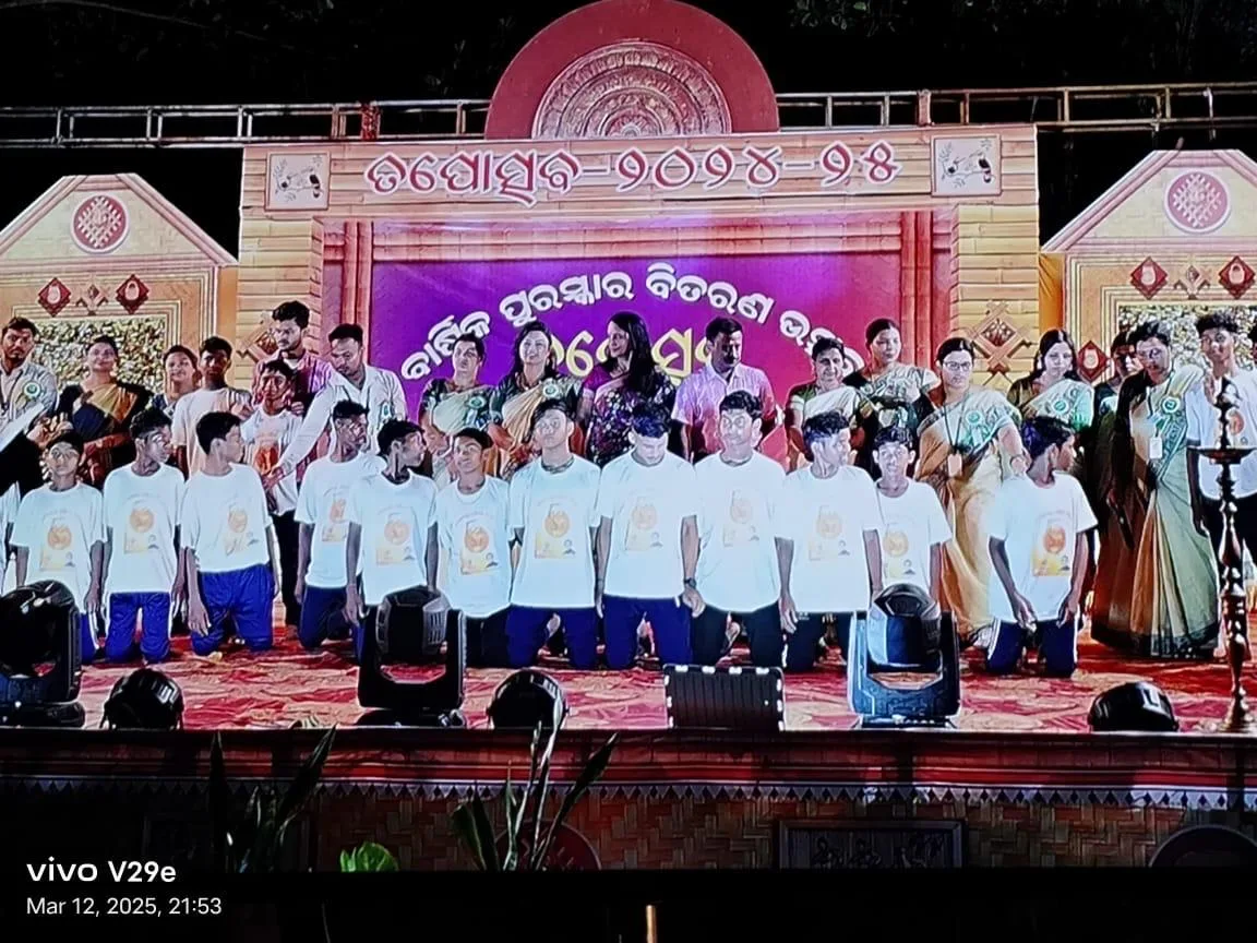 Students performing together on stage during a cultural program.